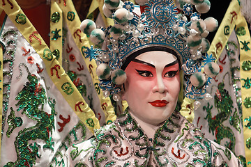 Image showing chinese opera dummy and red cloth as text space ,it is a toy,not