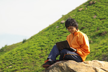 Image showing asain Man with notebook 