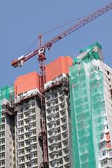 Image showing Construction crane at the construction site, on a cloudless sky 