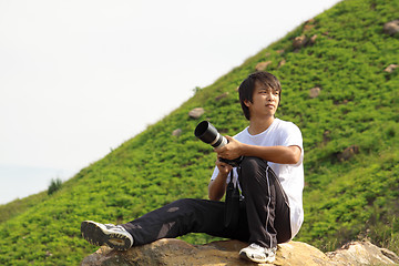 Image showing asian man taking photo 