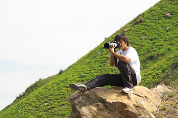 Image showing asian man taking photo 