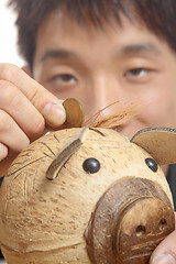 Image showing asia man with piggy bank 