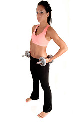 Image showing Girl lifting dumbbells.