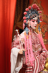 Image showing chinese opera dummy and red cloth as text space ,it is a toy,not