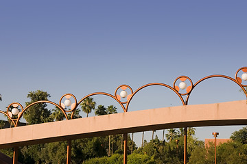 Image showing Unique Brass Lighting along the Bridge