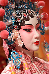 Image showing chinese opera dummy and red cloth as text space ,it is a toy,not