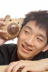 Image showing asia man with piggy bank 