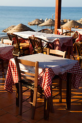 Image showing Outdoor restaurant tables in Perissa, Santorini, Greece