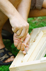 Image showing Man's hands on a screwdriver