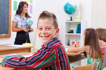 Image showing Cheerful young boy in school