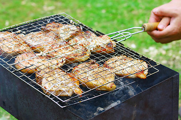 Image showing Steaks in Barbecue grill