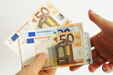 Image showing Handing Euros