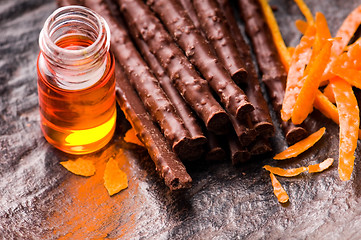 Image showing chocolate sticks with orange