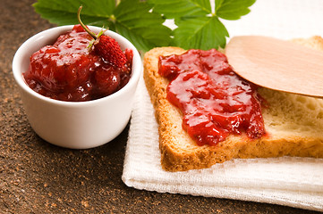 Image showing Wild strawberry jam with toast