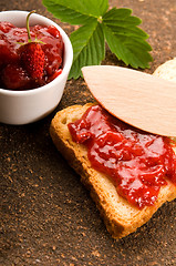 Image showing Wild strawberry jam with toast