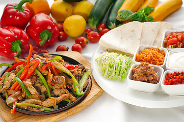 Image showing original fajita sizzling hot  on iron plate