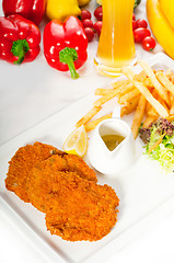 Image showing classic Milanese veal cutlets and vegetables