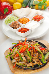 Image showing original fajita sizzling hot  on iron plate