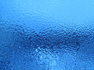 Image showing natural water drops on glass