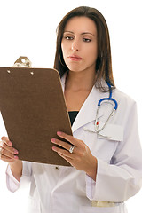 Image showing Doctor reading medical records