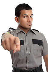 Image showing Security or Prison officer pointing finger