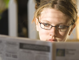 Image showing Young lady reading