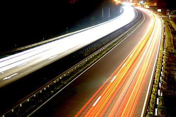 Image showing road with car traffic at night with blurry lights