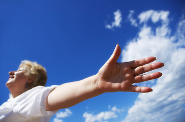 Image showing Free woman on the sky background