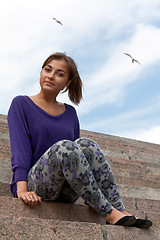 Image showing girl sitting on the marble stairs 