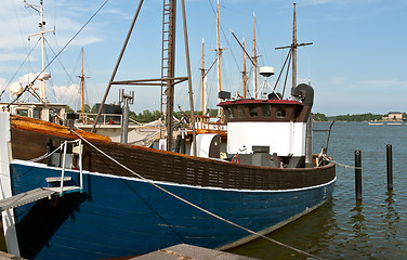 Image showing Wooden blue boat in the port