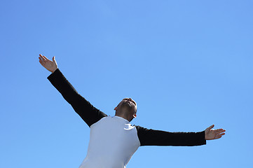 Image showing Free man on the sky background