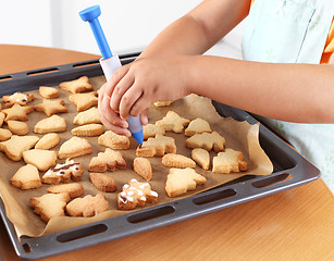 Image showing Decorating cookies