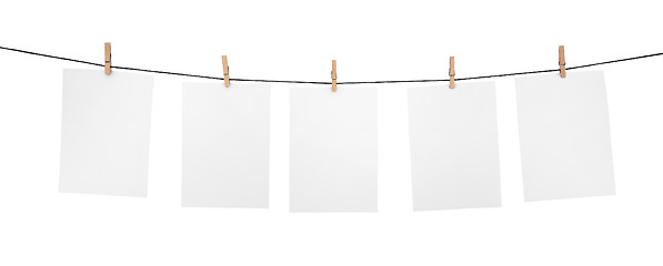 Image showing 5 clean sheets on clothesline