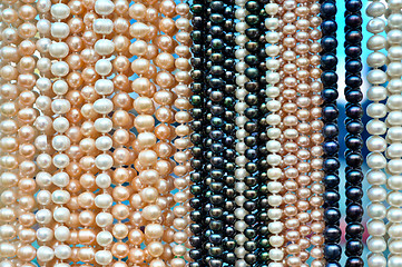 Image showing a lot of pearl beads hanging in a row