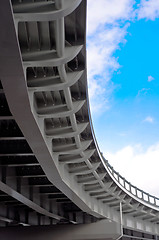 Image showing automobile overpass on background of blue sky with clouds. botto