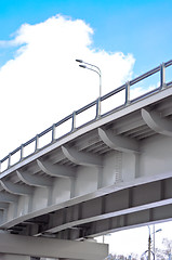 Image showing automobile overpass on background of blue sky with clouds. botto