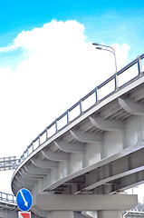 Image showing automobile overpass on background of blue sky with clouds. botto