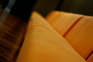 Image showing beige sofa in the room with dark green walls close up