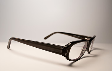 Image showing Black glasses over white background