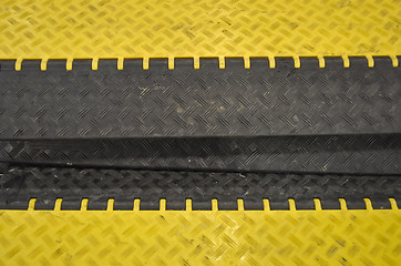 Image showing black-yellow speed bumps Humps