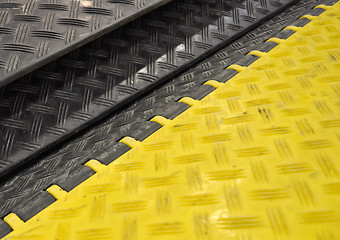 Image showing black-yellow speed bumps Humps