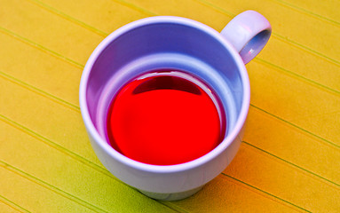 Image showing Blue cup with a compote on the green napkin