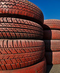 Image showing close up of racetrack fence of  red old tires