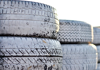 Image showing close up of racetrack fence of  white old tires