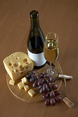 Image showing Bottle and glass of white wine with cheese