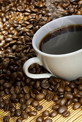 Image showing Coffee cup with roasted beans