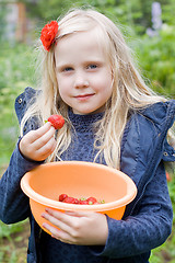 Image showing Beautiful Girl with Red Strawberry in Garden