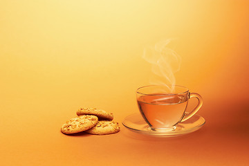 Image showing Cup of hot tea with chocolate cookies