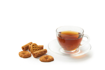 Image showing Cup of hot tea with cookies