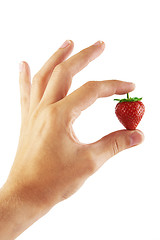 Image showing Fresh strawberry in a hand